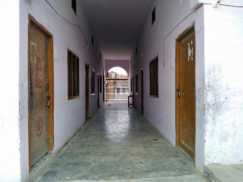 A whitewashed corridor of the hostel