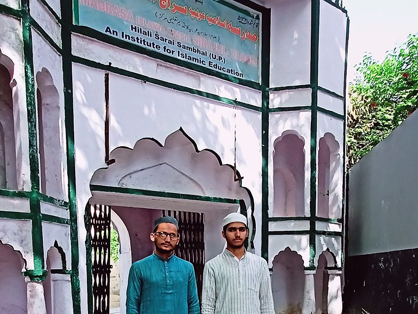 Students at the arched entrance