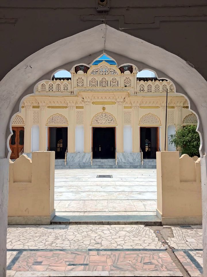 The façade through the campus arch, 2026