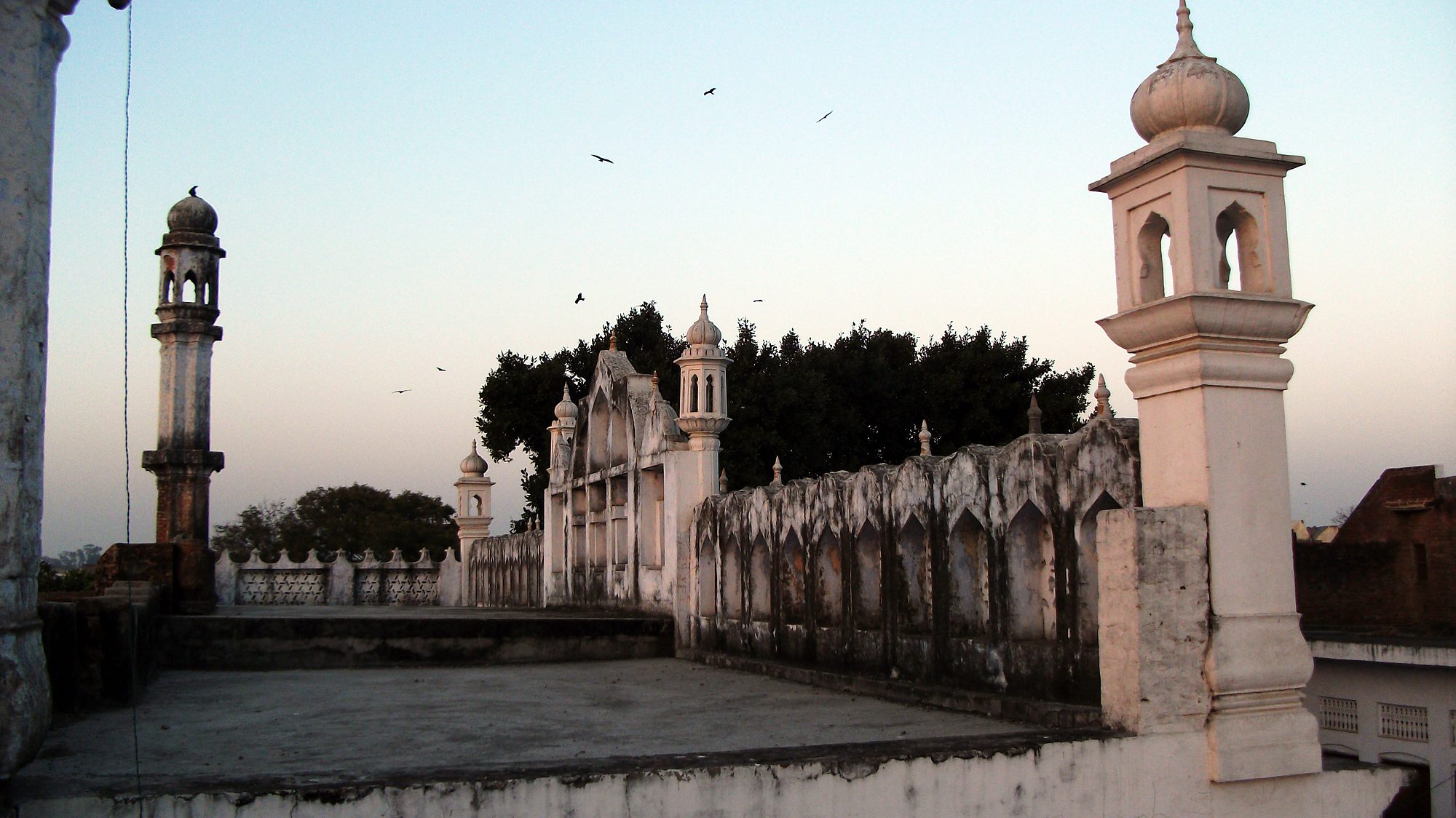 Rooftop view towards the minaret at sunset